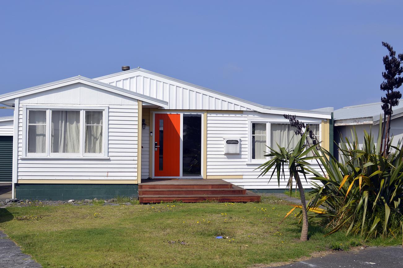 The Orange Door Bach House for Rent in Opunake, Taranaki, NZ Riparide