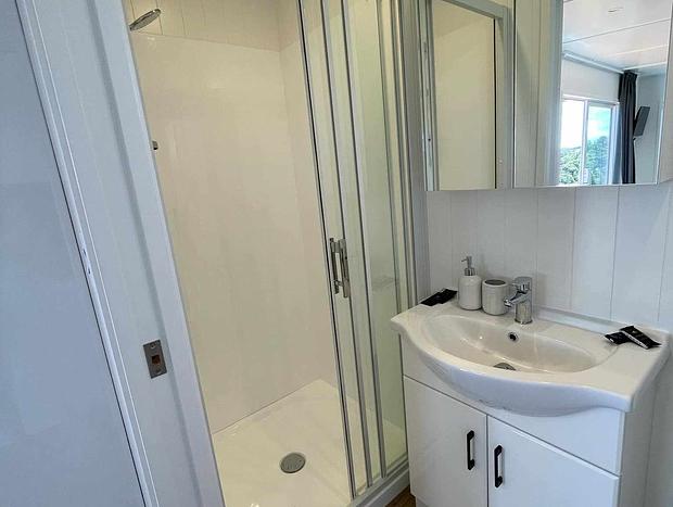 Photo 8 for Private with Stunning Ocean and Bush Views- Tui View Cabin